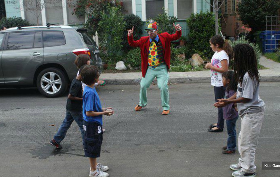 Mr. Nick entertaining children at a Los Angeles neighborhood party